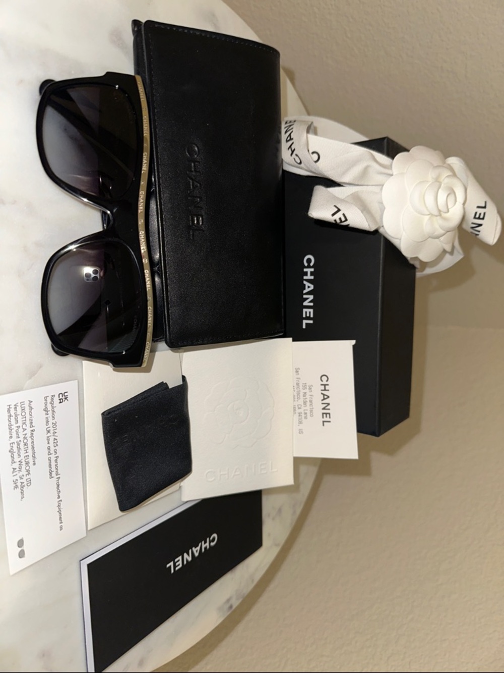 CHANEL Black Sunglasses with Gold Logo Trim